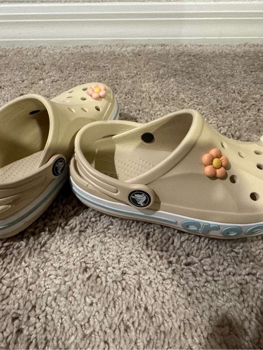 CROCS Kids Cream Clogs with Pink Yellow and White Flower Charms